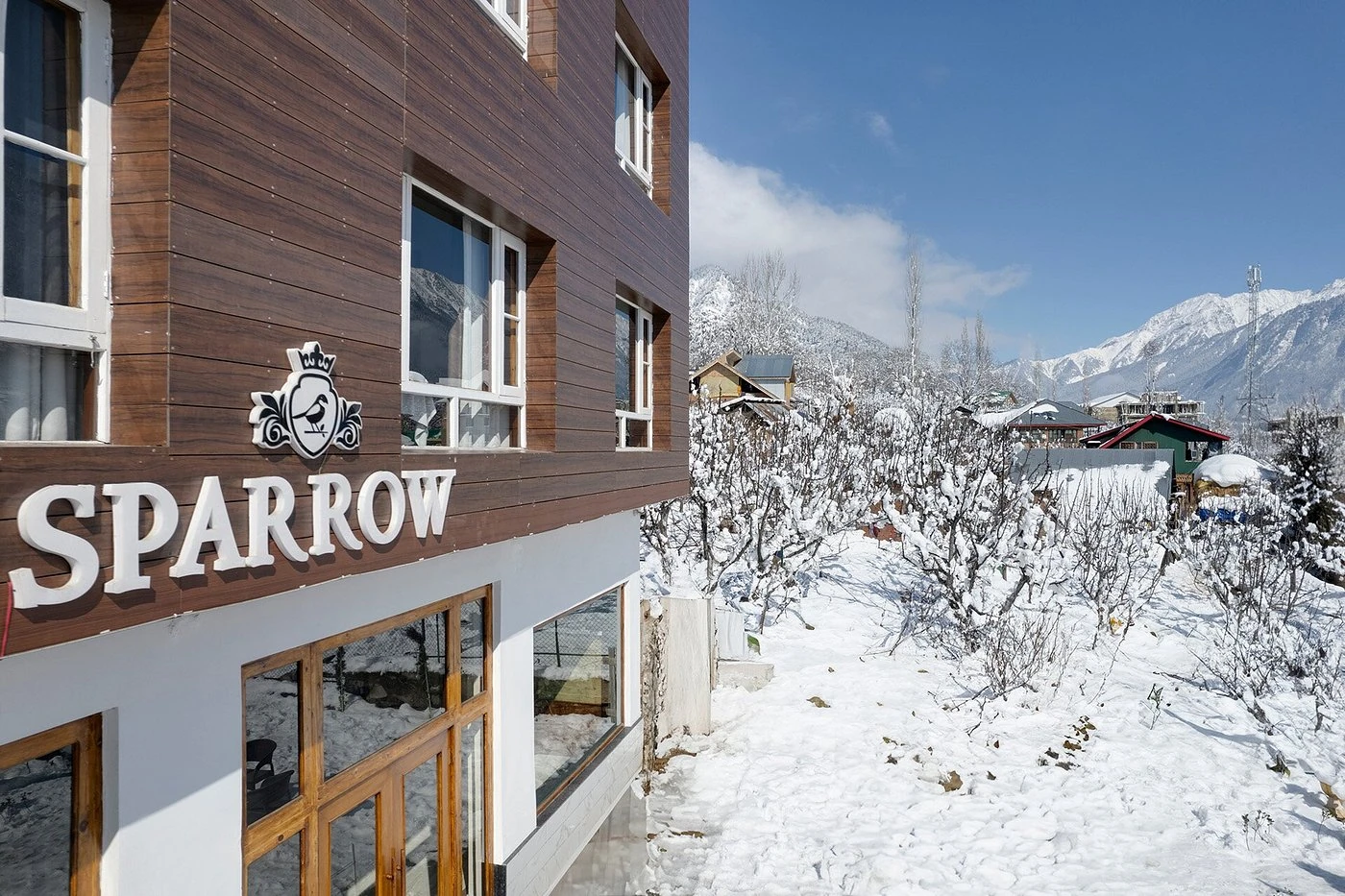 Hotel Sparrow exterior with the Pahalgam valley behind it