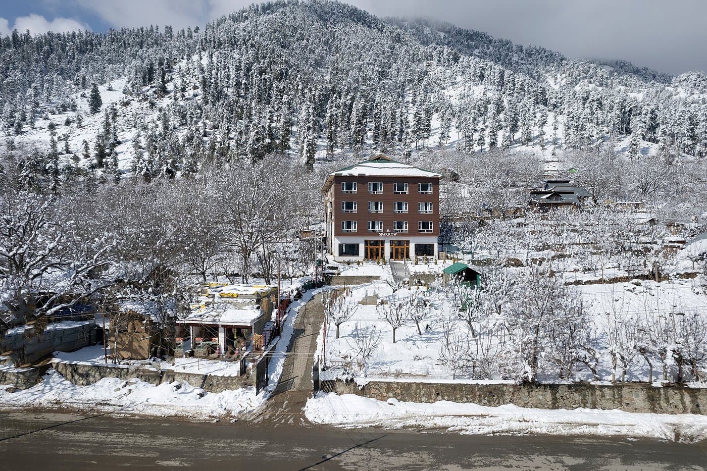 Aerial view of Hotel Sparrow in the snow-covered Pahalgam valley