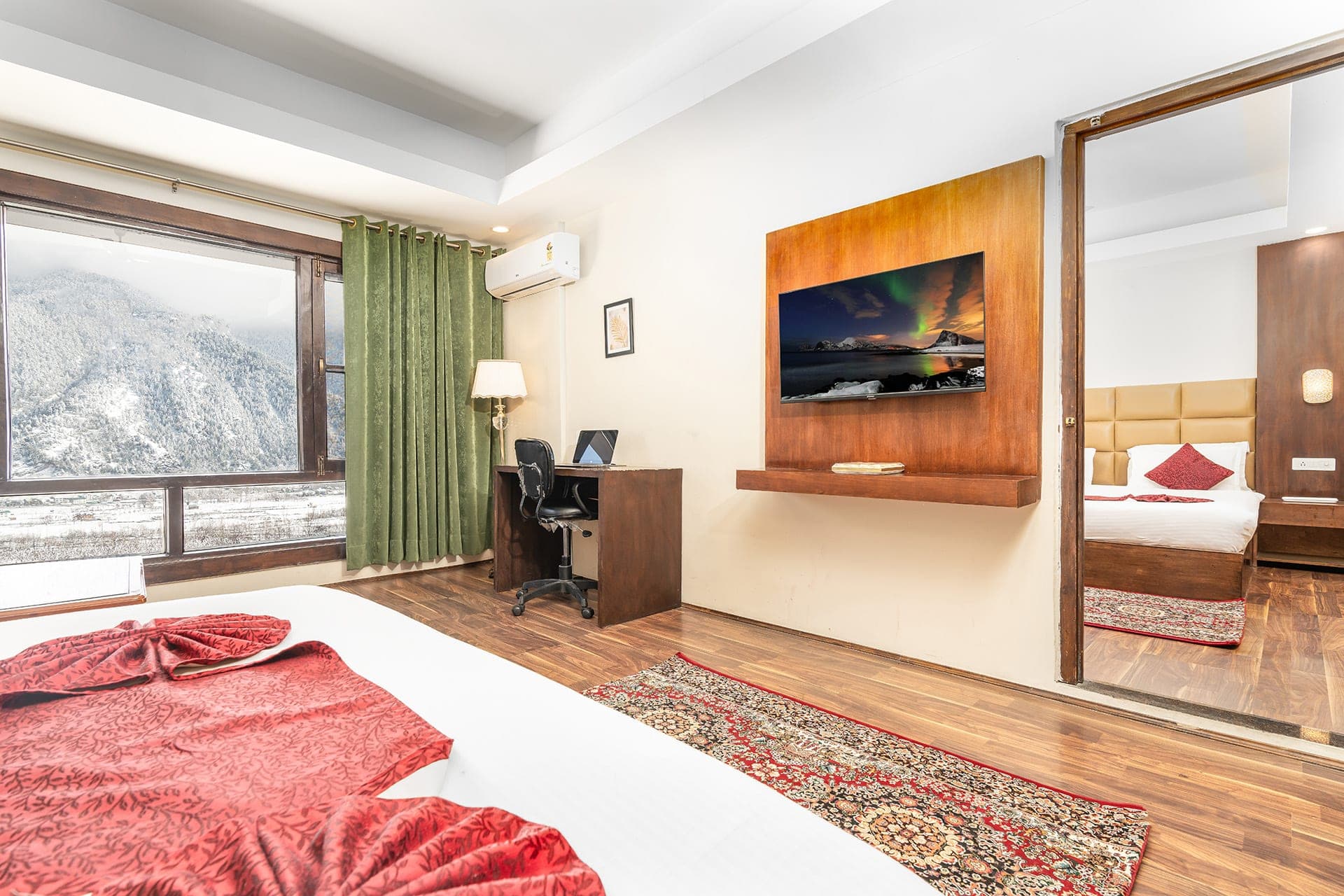 Family interconnected room at Hotel Sparrow with two king beds and mountain view