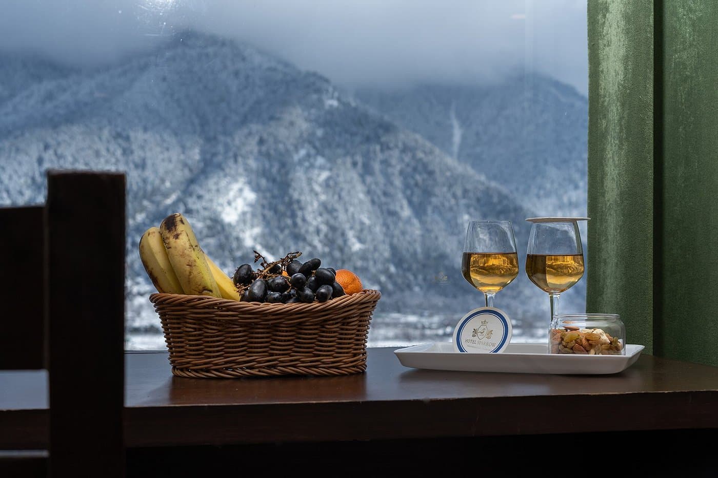 In-room refreshments with a mountain backdrop