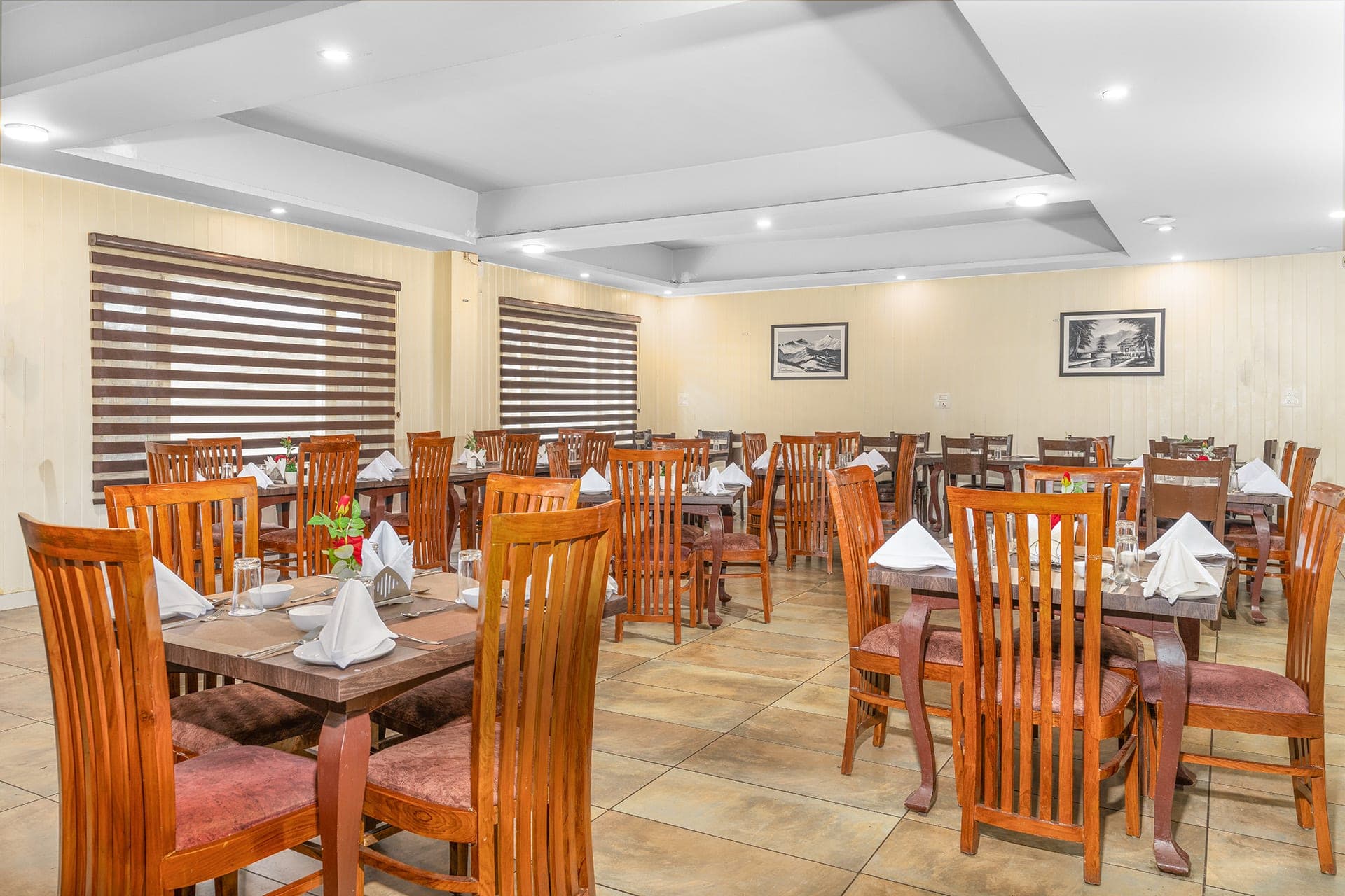 In-house dining hall at Hotel Sparrow with warm wooden furnishings In-house dining hall at Hotel Sparrow with warm wooden furnishings