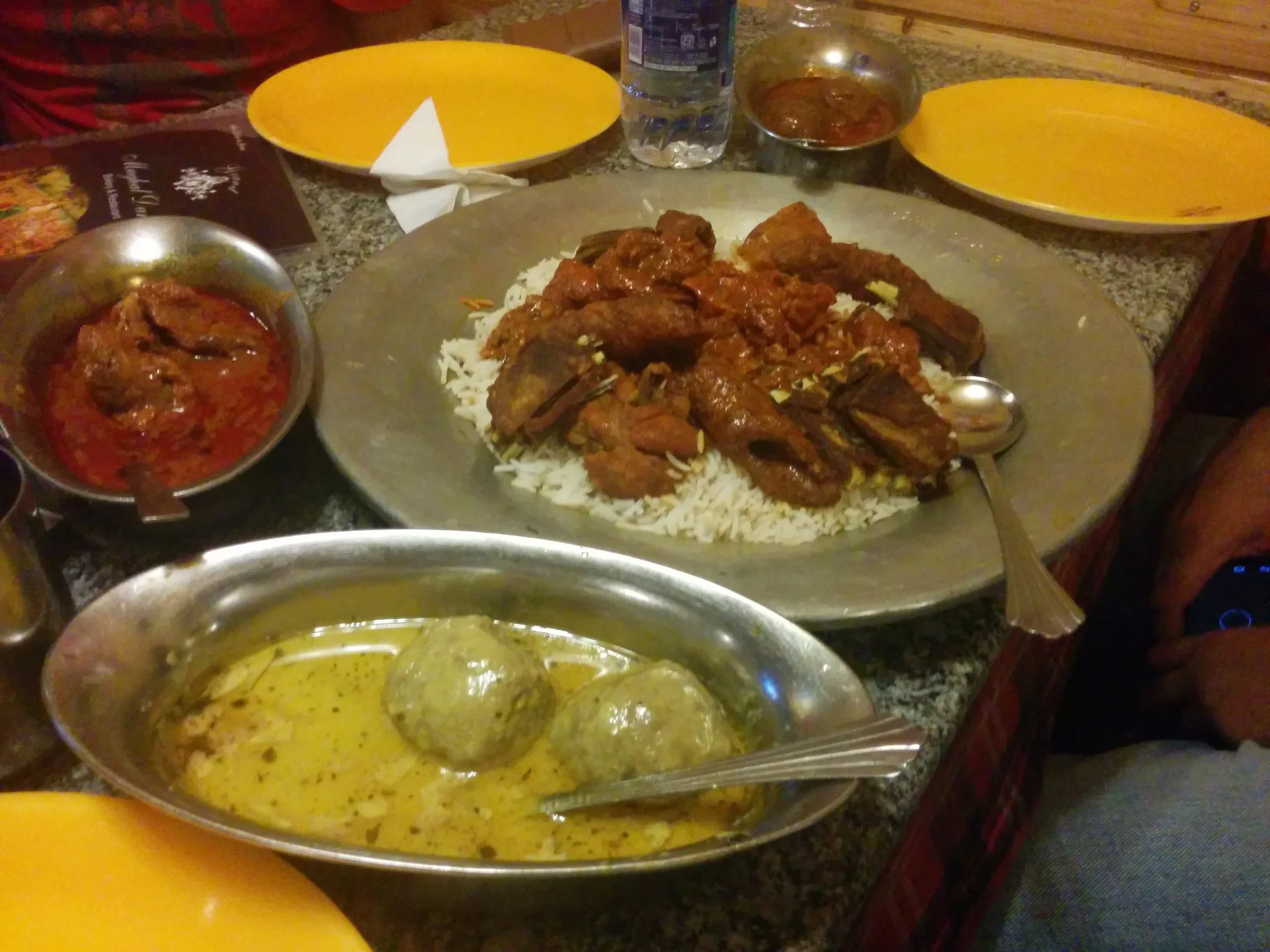 Kashmiri wazwan dishes on a shared platter: rista and rogan josh over rice, with gushtaba in yoghurt gravy Kashmiri wazwan dishes on a shared platter: rista and rogan josh over rice, with gushtaba in yoghurt gravy